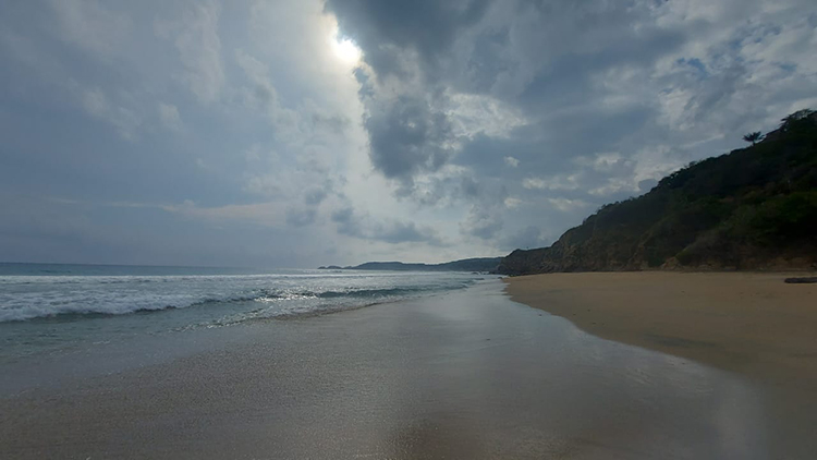 view of the beach and clouds