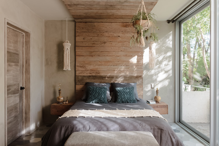 Master bedroom with reclaimed lumbar and artisan curtains