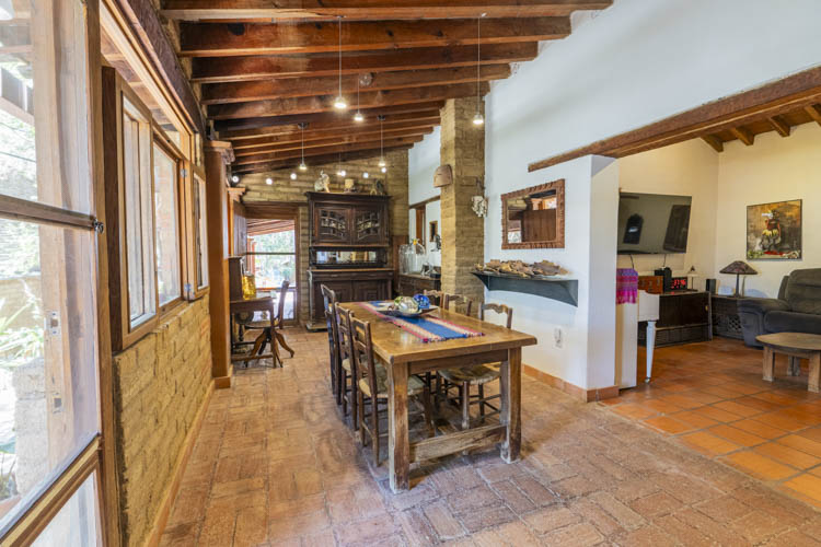 dining room with wooden beamed ceiling