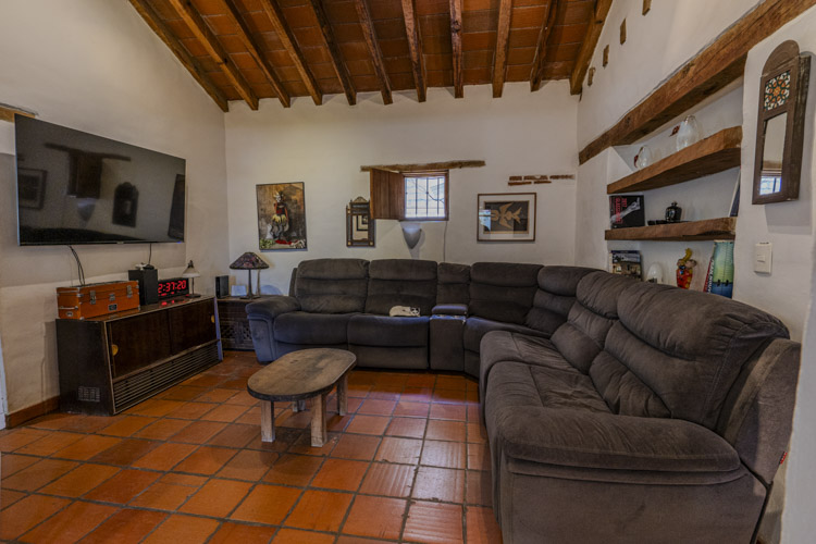 living room with wooden beamed ceiling