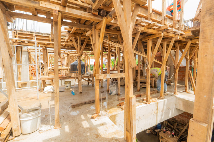 Oaxaca Mexico condo construction with wooden framing to complete the third floor