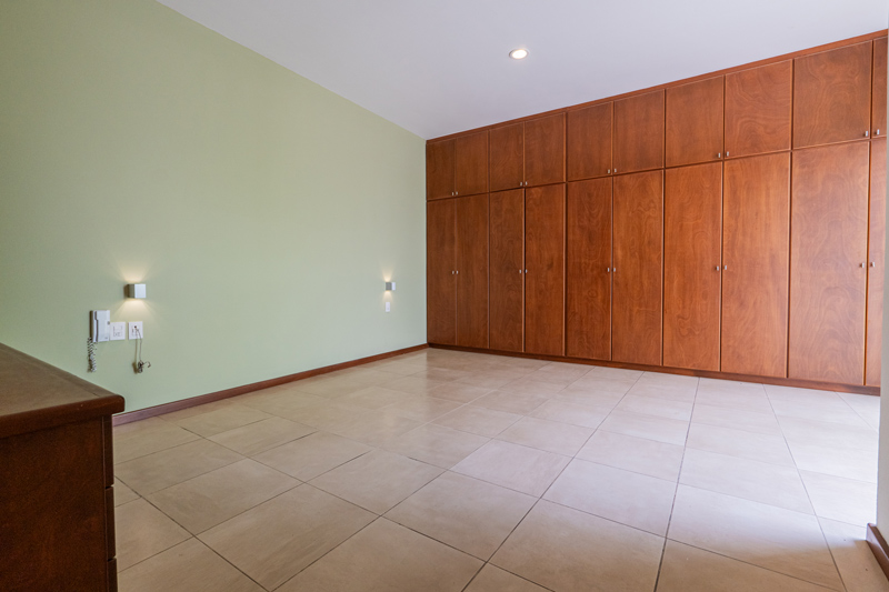 bedroom with wooden closet