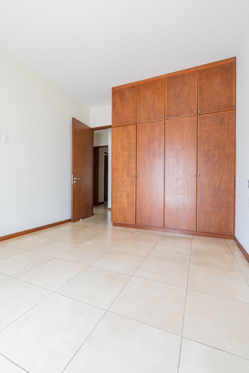 bedroom with wooden closet