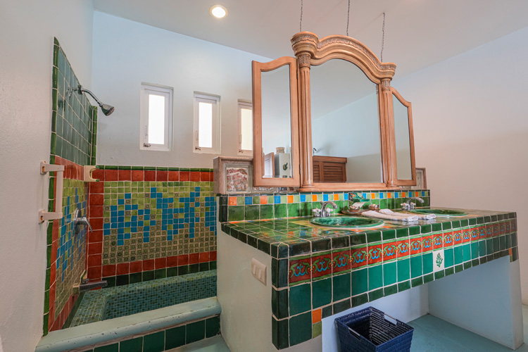 penthouse condo master bathroom with green tile