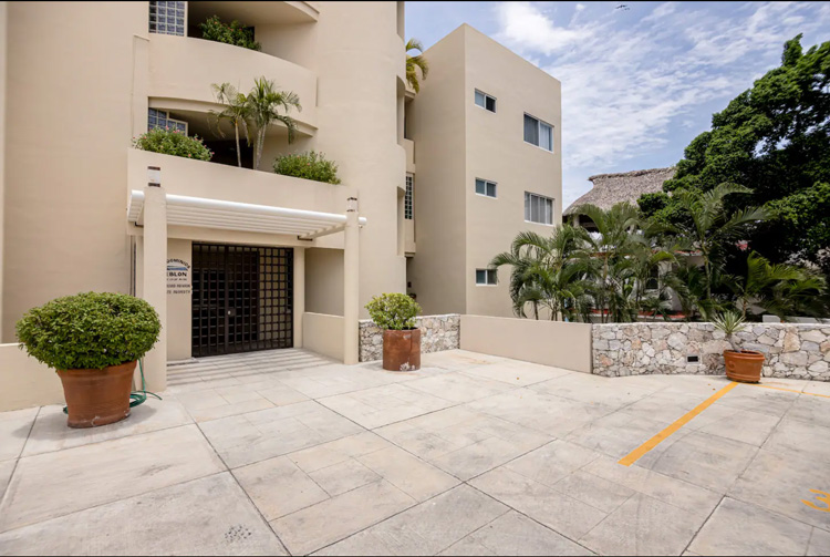 parking lot view facing beachfront waterfront condo building in puerto escondido oaxaca mexico