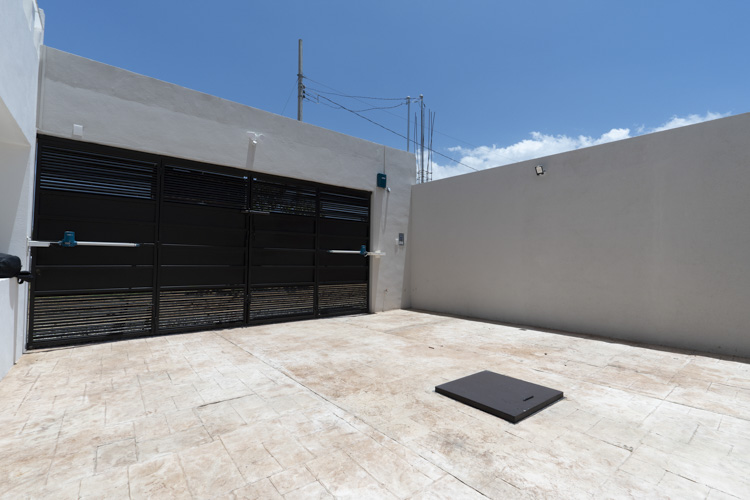 secure parking behind garage door with automatic opener and cistern access