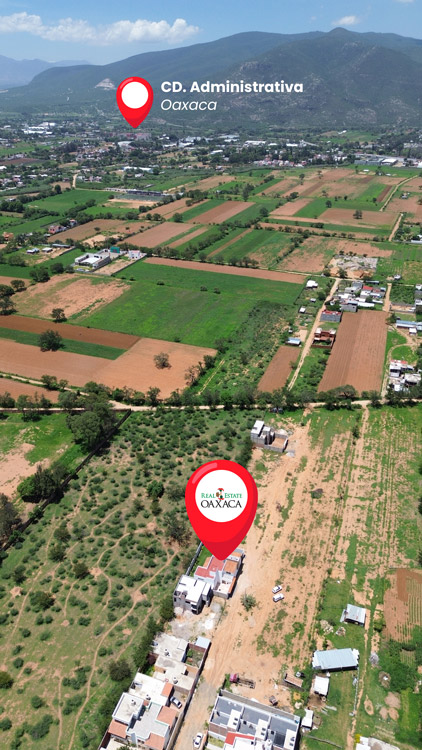 aerial photo over Tlalixtac de Cabrera Oaxaca showing home for sale and city hall municipal building