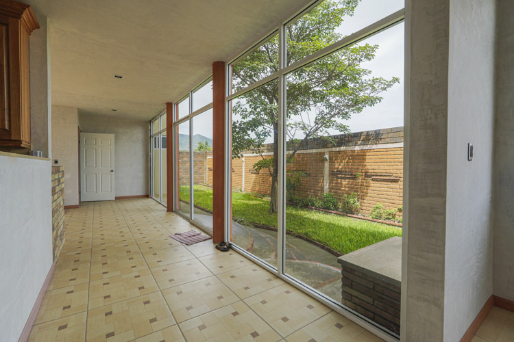 natural lighting from sliding glass doors into TV living room and big window