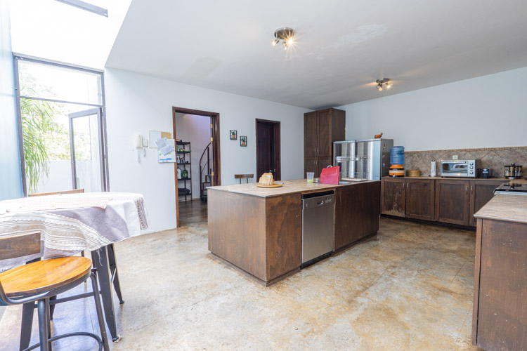 kitchen with island countertop and lots of natural light in Tlalixtac