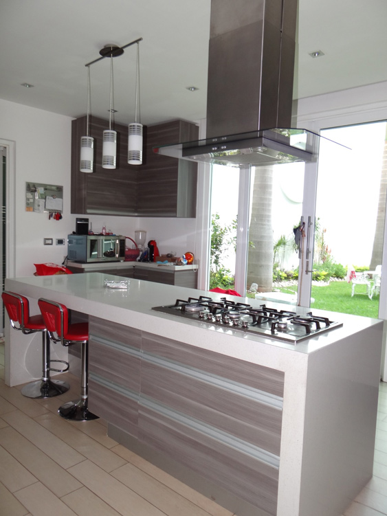 kitchen with gas range on white island countertop